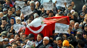 People carry the coffin of late oppositi