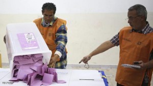Electoral workers prepare to count ballots after polling stations closed in Benghazi