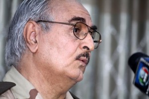 Retired Libyan Army general Khalifa Haftar speaks during a press conference in the town of Abyar, 70 km southwest of Bengahzi, on May 17, 2014. Haftar says his campaign against the Islamists aims to purge the restive city of "terrorist" groups, but he has been denounced by the authorities in Tripoli of trying to stage a coup -- a charge he denies. AFP PHOTO/STR